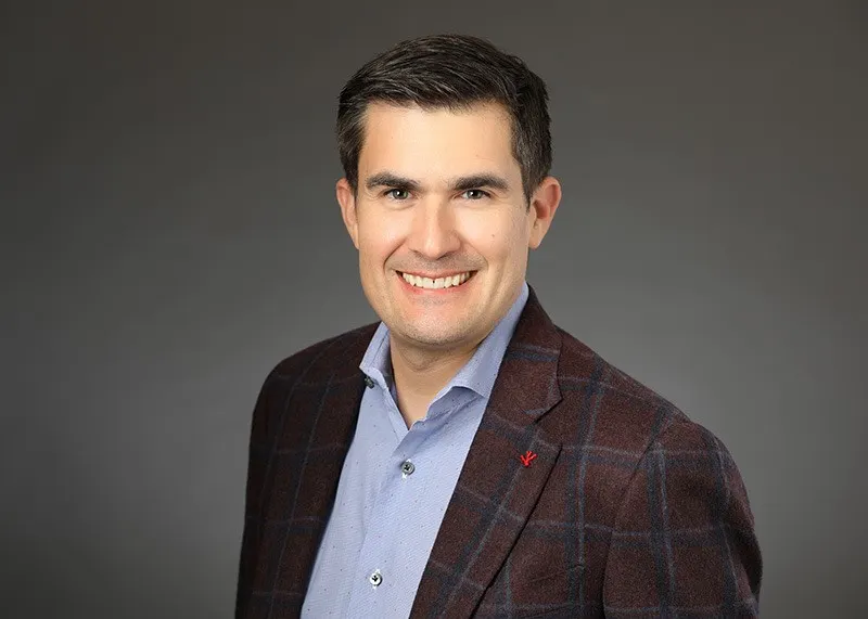 A professional headshot.
