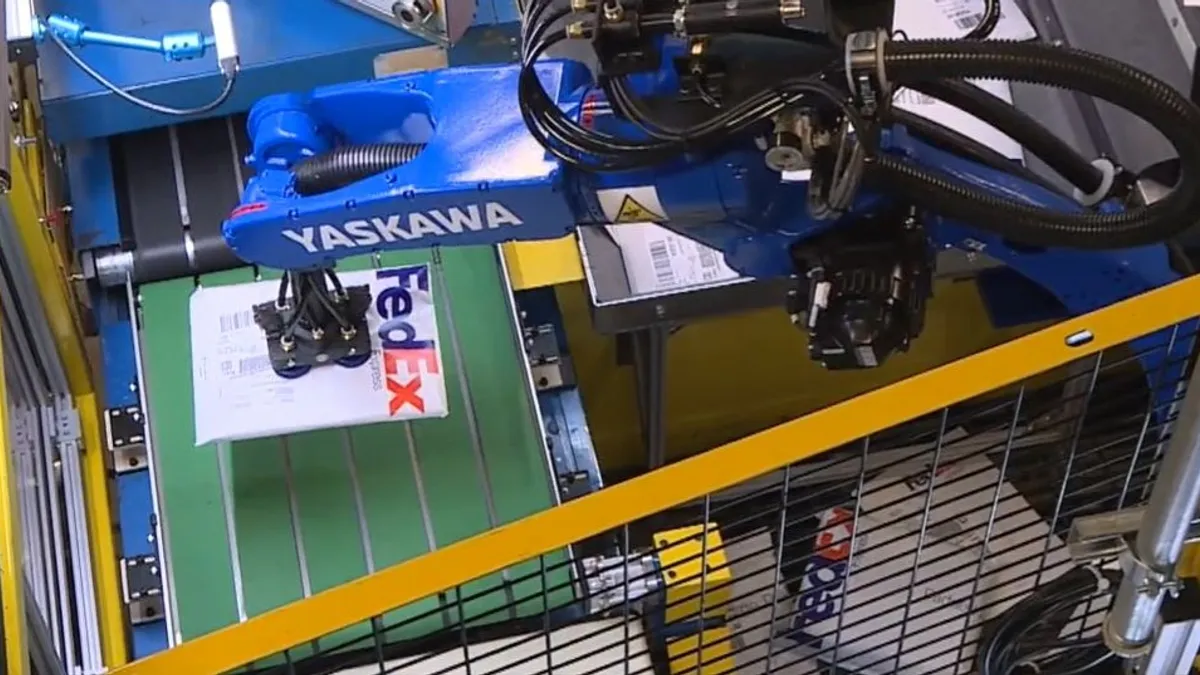 Yaskawa robot arm in FedEx sortation hub