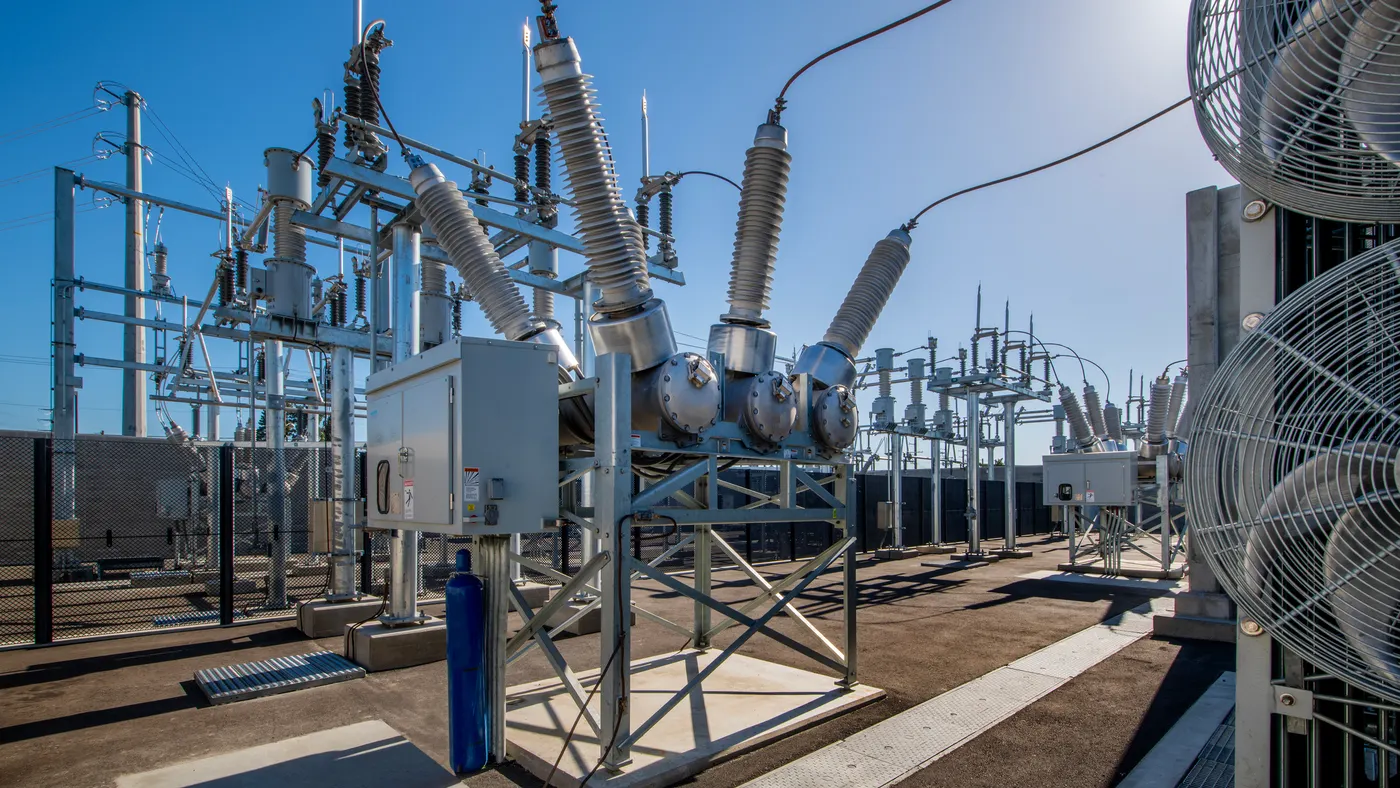 An electrical substation with breakers and transformers.