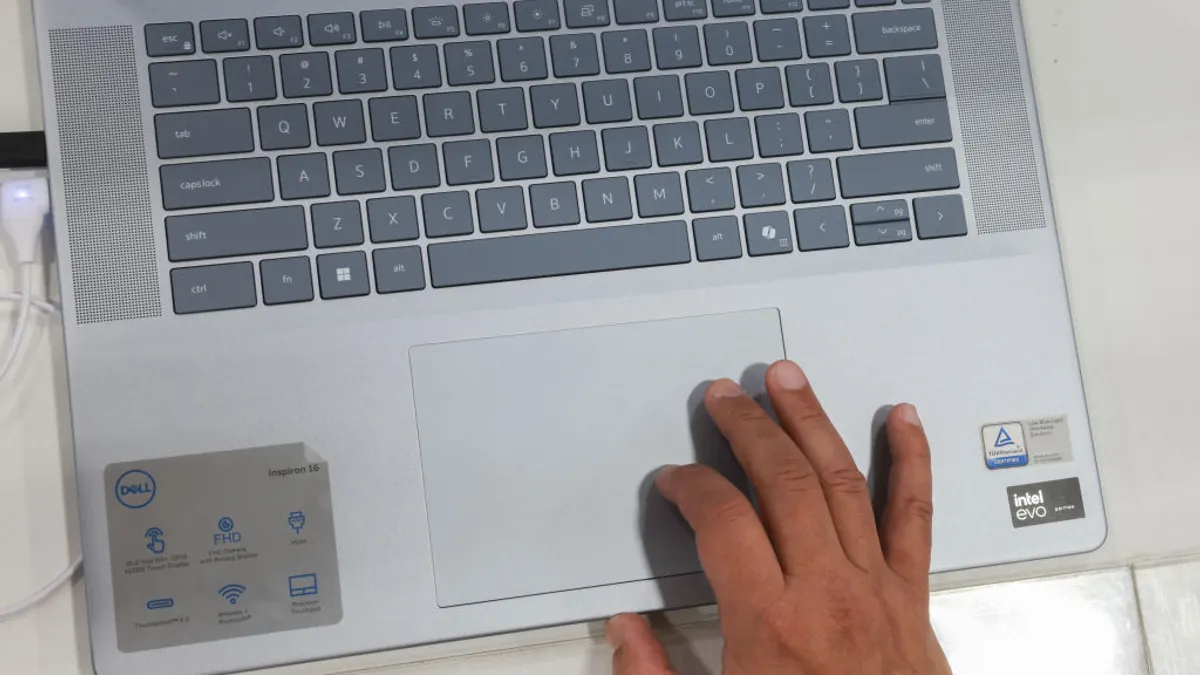 a display case showing an AI-enabled laptopt