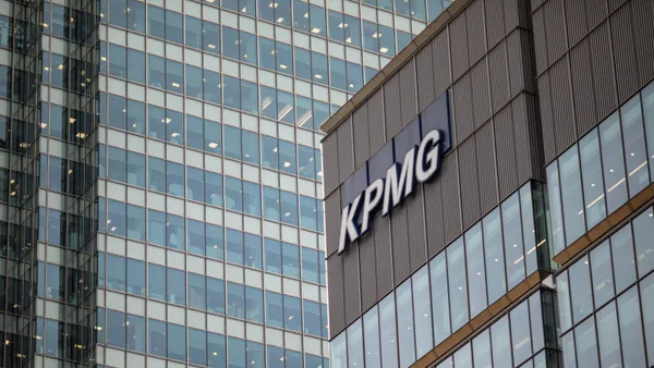 KPMG logo is displayed on its office building.