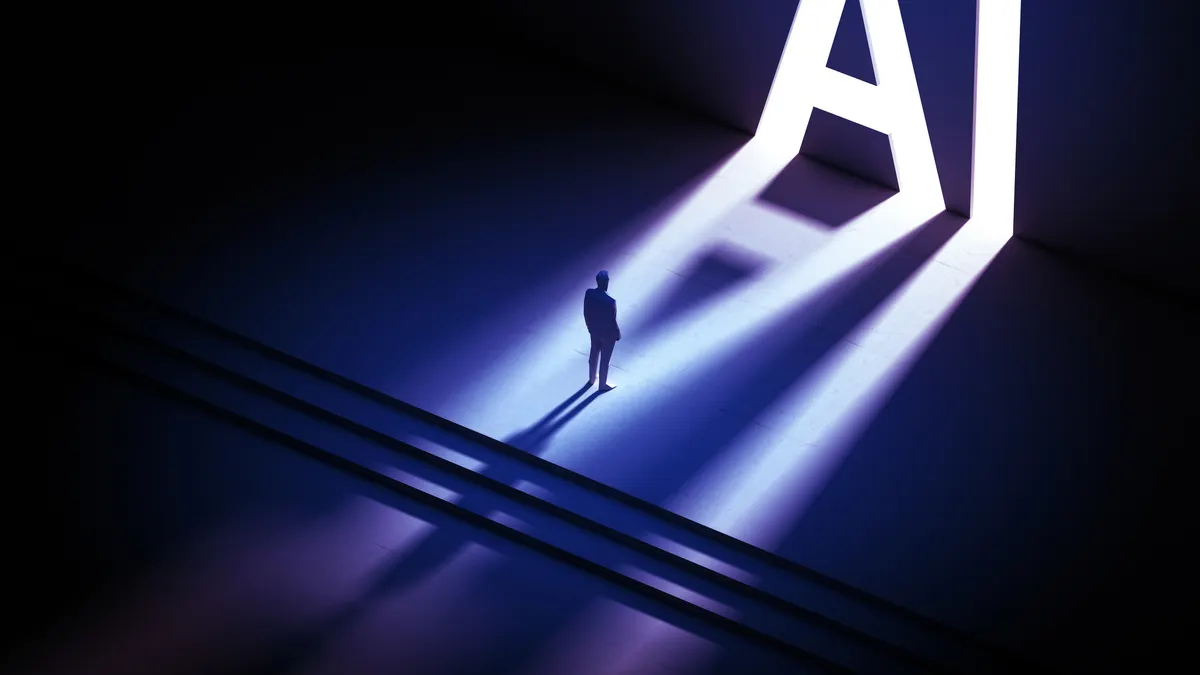 Person standing in front of doors that shine AI on ground