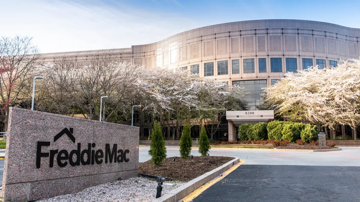 Freddie Mac sign with office building in the background.