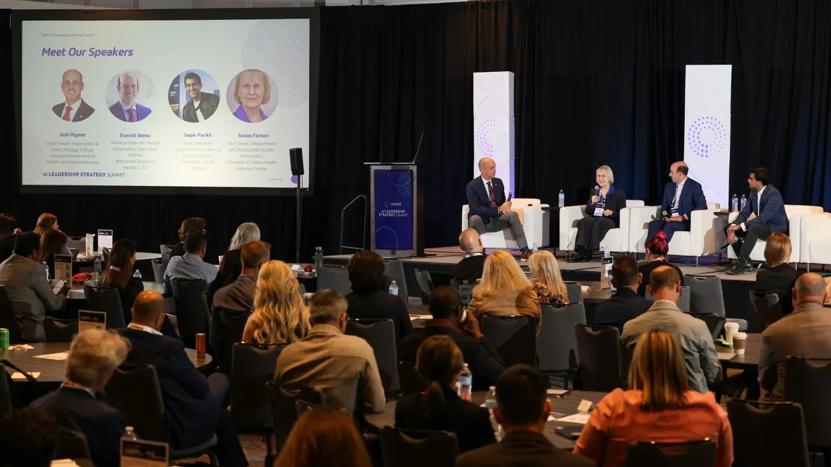 Panelists speak in front of a crowd at the the HIMSS AI Leadership Strategy Summit in Chicago.