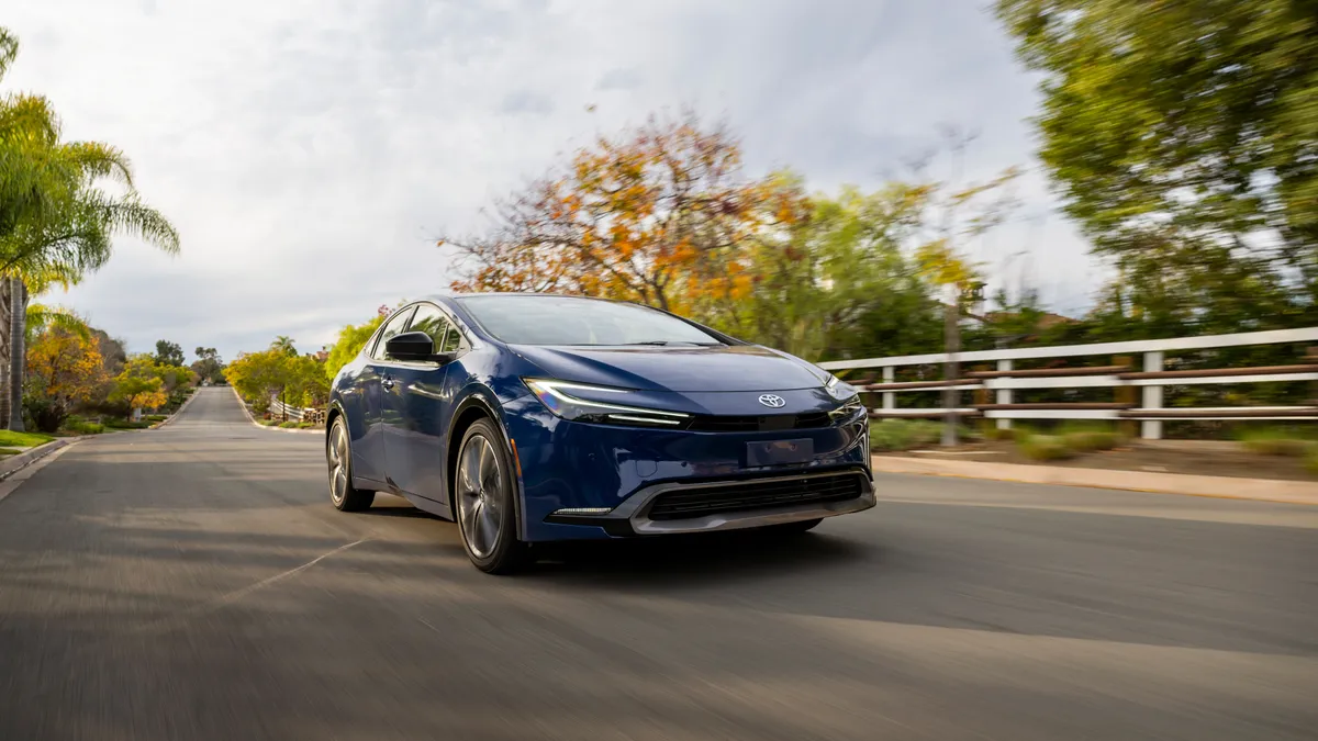 A 2024 Toyota Prius Limited driving.