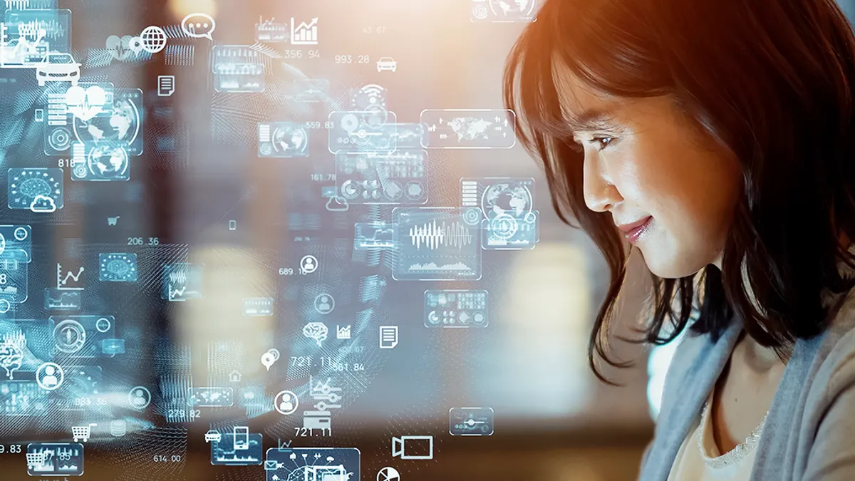 Woman watching hologram screens. Business and technology concept.