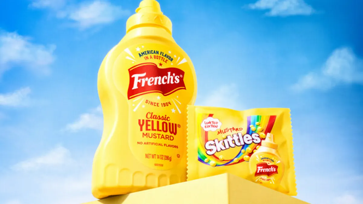 A bottle of French's mustard next to a bag of mustard Skittles.