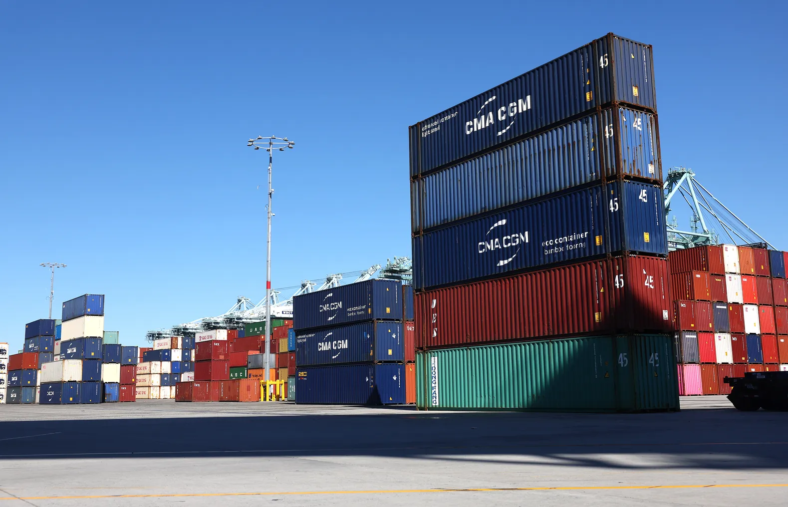 Shipping containers are stacked at the Port of Los Angeles on February 7, 2023 in Los Angeles, California.