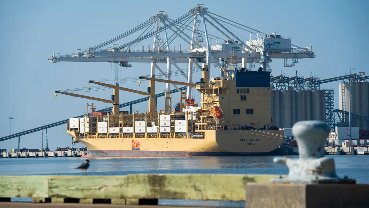 A Dole containership is loaded at a port.