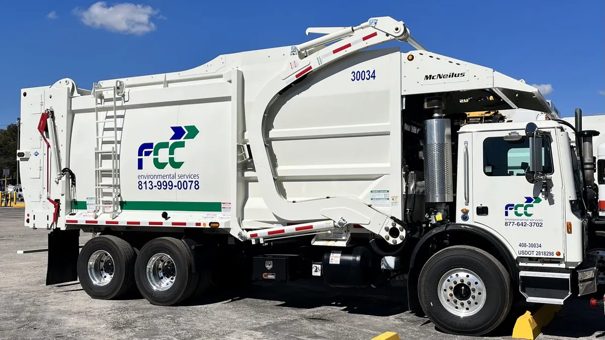 Side view of FCC Environmental waste truck