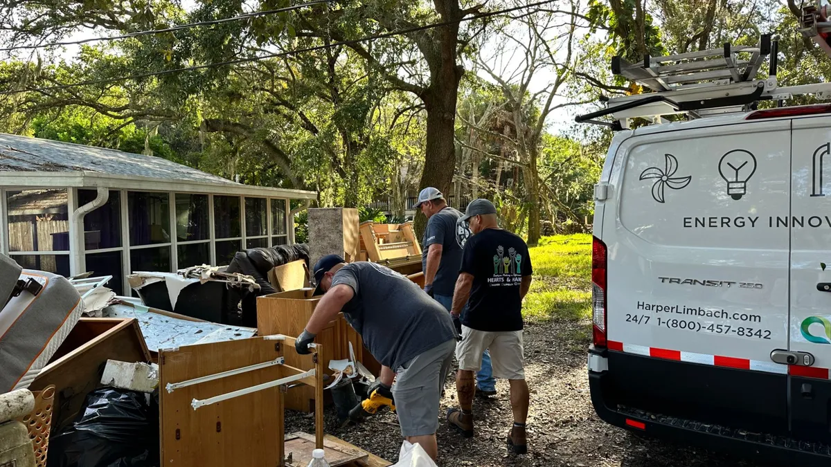 Workers perform hurricane cleanup