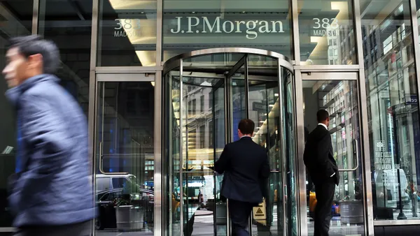 People pass the JPMorgan Chase & Co. headquarters on the street.