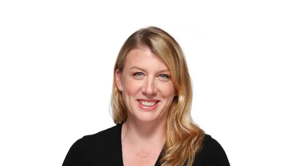 A headshot of a blonde person on a white background.