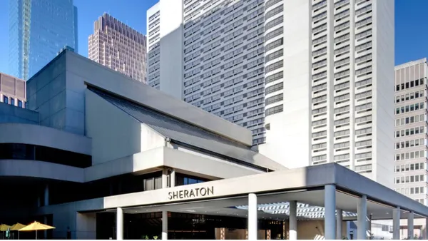 An image shows the exterior of the Sheraton Philadelphia Downtown.