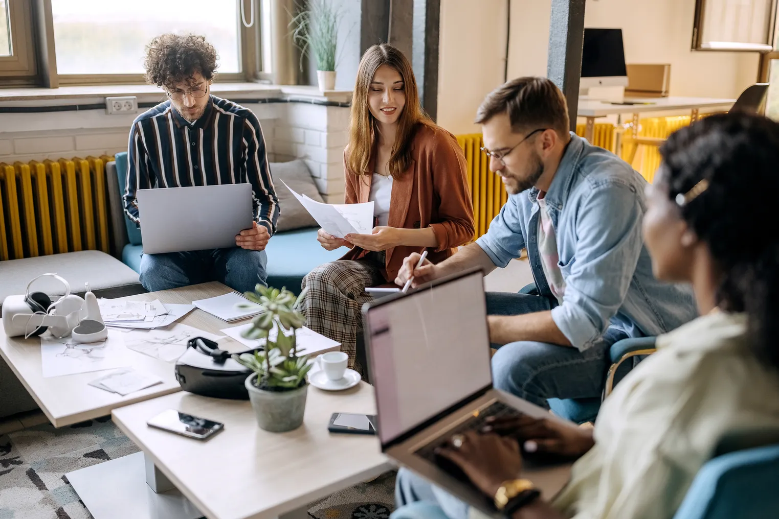 Group of Gen Z employees working in office