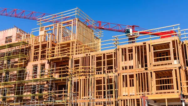 Exterior view of multifamily residential building under construction.