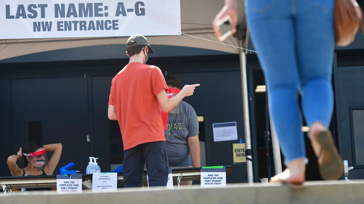 People stand at a table.