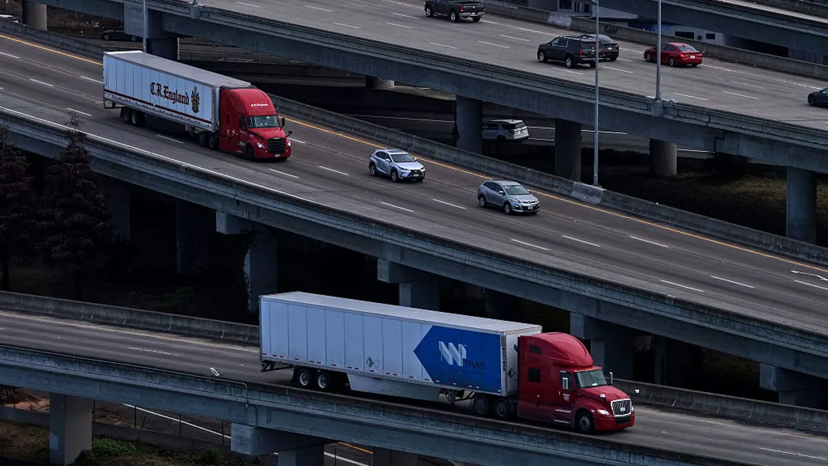 trucks traveling on a highway