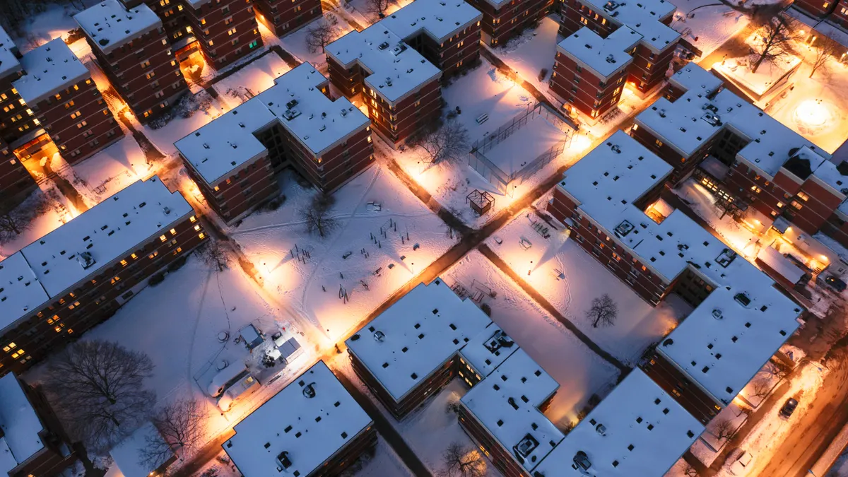 Aerial shot of buildings covered with snow