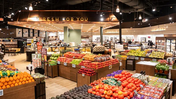 View of The Fresh Market's center store area, including produce area and Fresh For You department