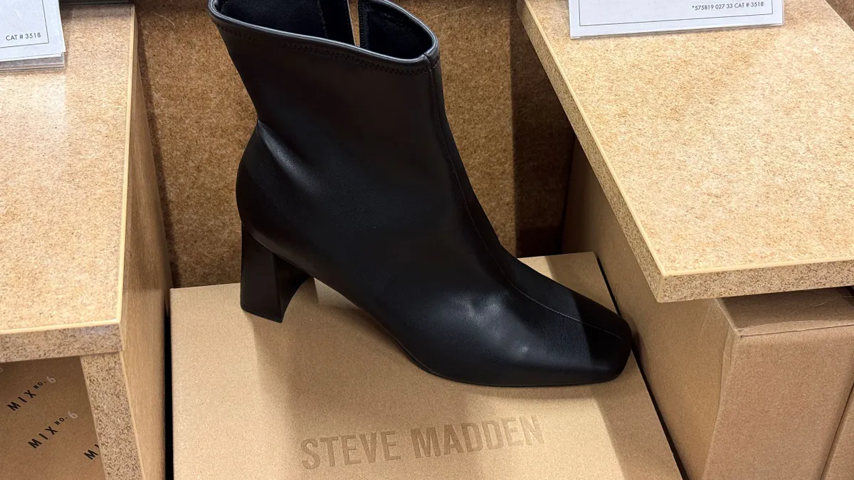 A Steve Madden boot on display at a store.