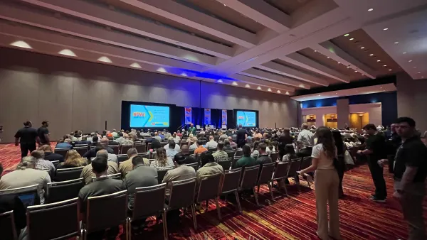 Attendees sit in an auditorium for the opening session of the NFMT East Conference.