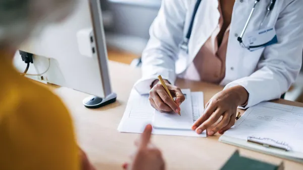 A doctor discusses results with a patient.