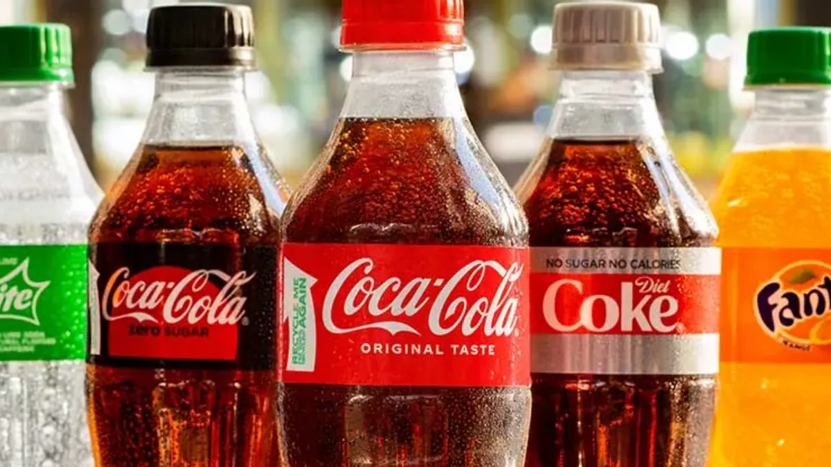 Close-up across of 5 rPET Coca-Cola bottles: Sprite, Coca-Cola Zero Sugar, Coca-Cola Original, Diet Coke, Fanta