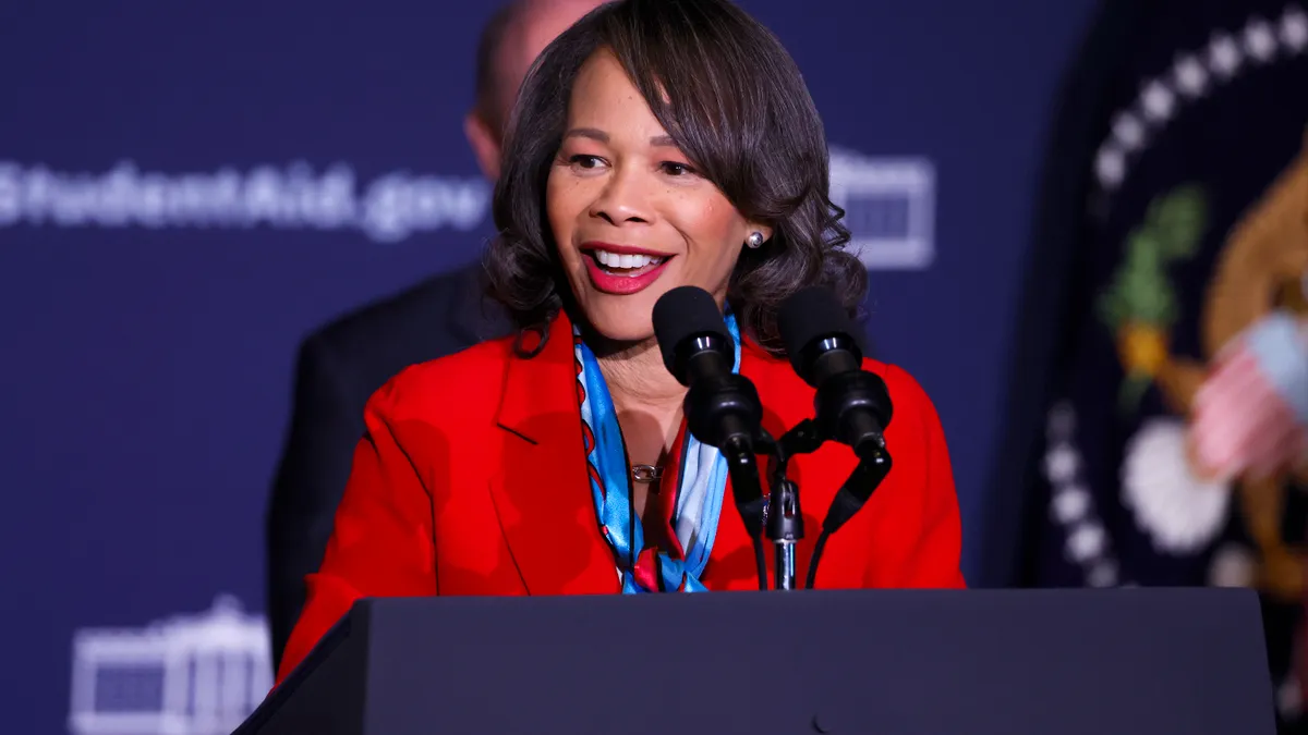 Lisa Blunt Rochester speaks at a podium.