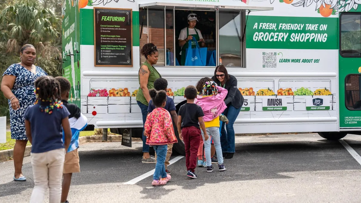 Children approaching Sprouts Mobile Truck