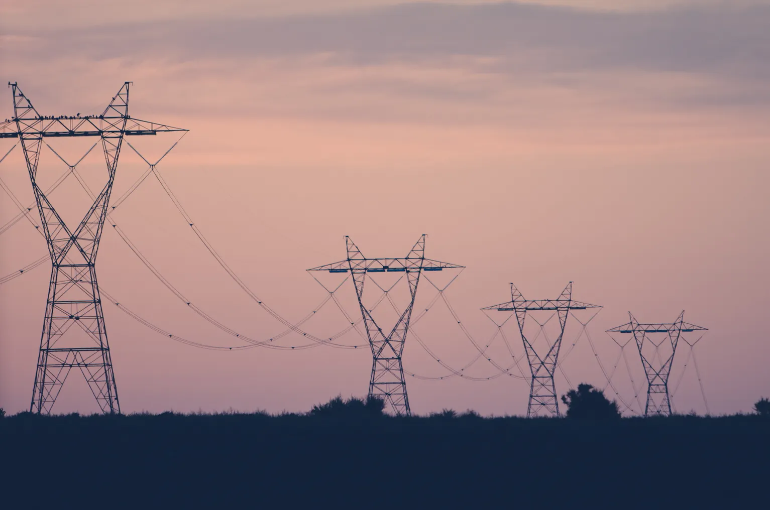 Industrial power lines stretching across the Idaho desert