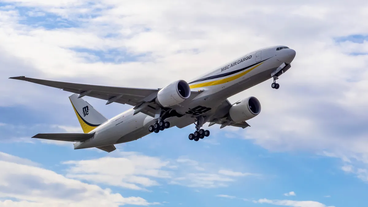 An MSC-branded aircraft in a blue sky with clouds.