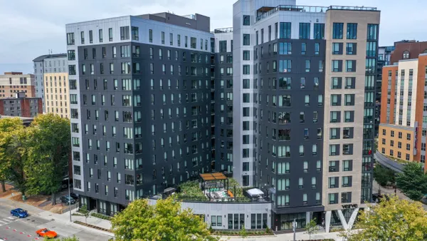 Tall, multi-colored high rise apartments.