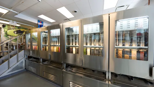 A photograph of a makeline with various cabinets and ingredients ready to deploy into bowls.