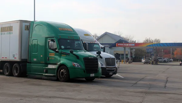 Tractor-trailers parked near a gas station on the Pennsylvania Turnpike in 2024.