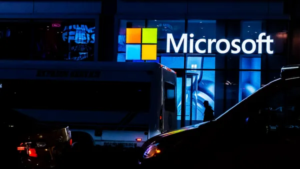 A building facade with the Microsoft logo and it's night time