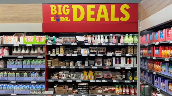 Supermarket shelves with a sign reading "Big Lidl Deals" at the top.
