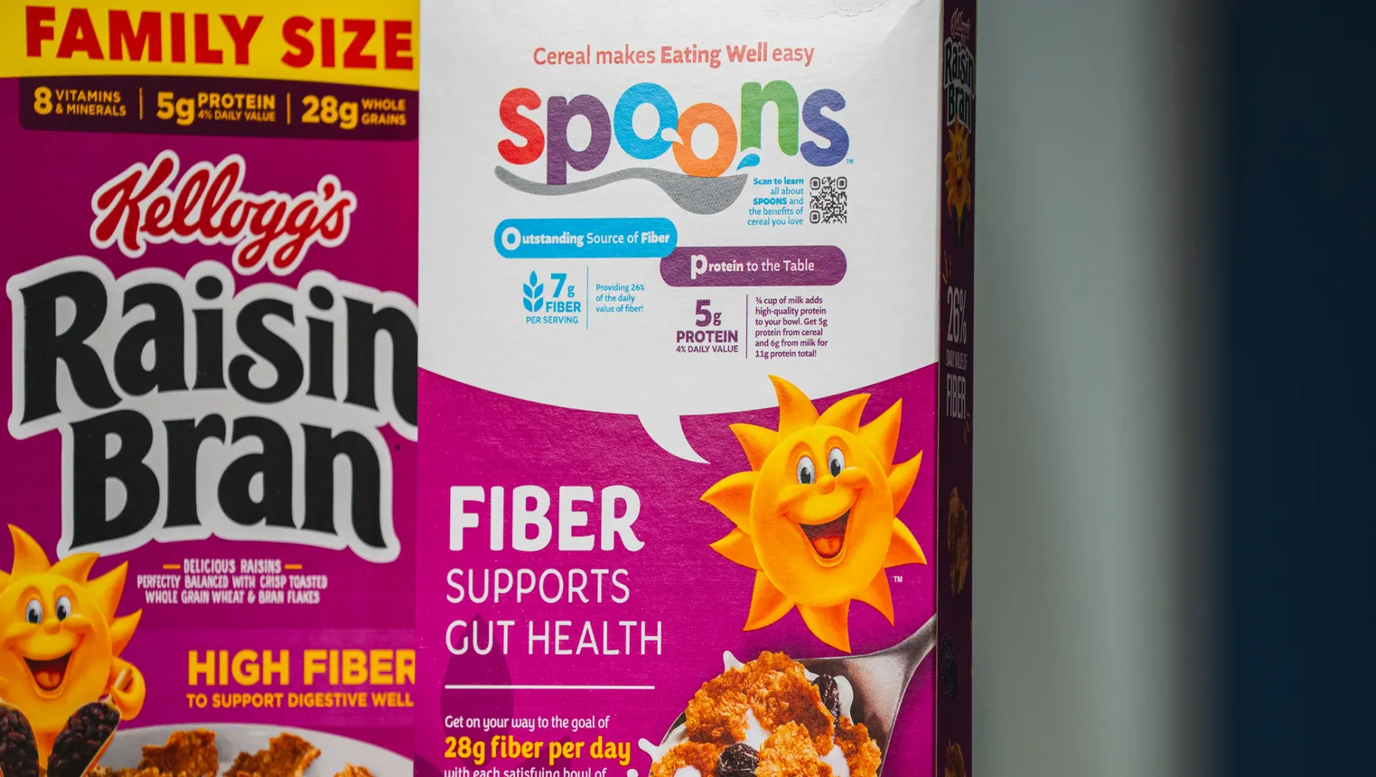 A box of WK Kellogg's cereal with a SPOONS nutrion label