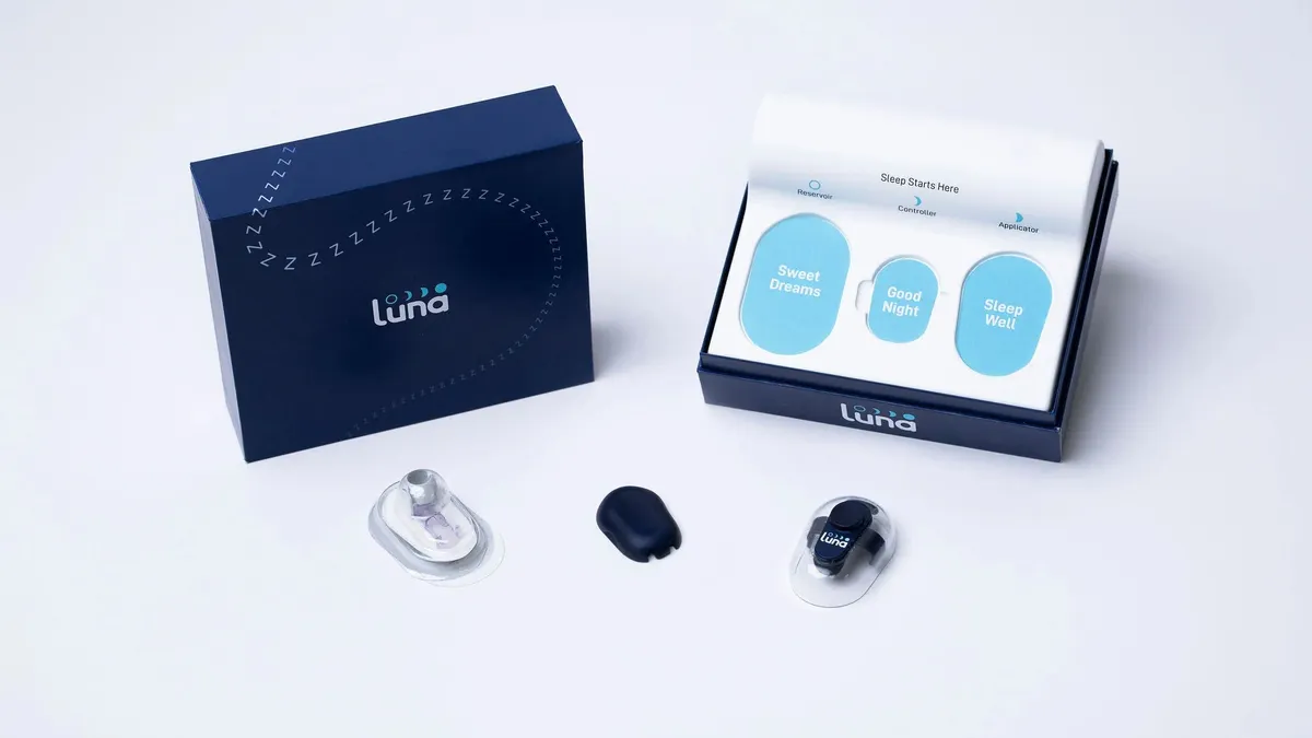 A box says Luna on the front, with three oval-shaped components in front of it.