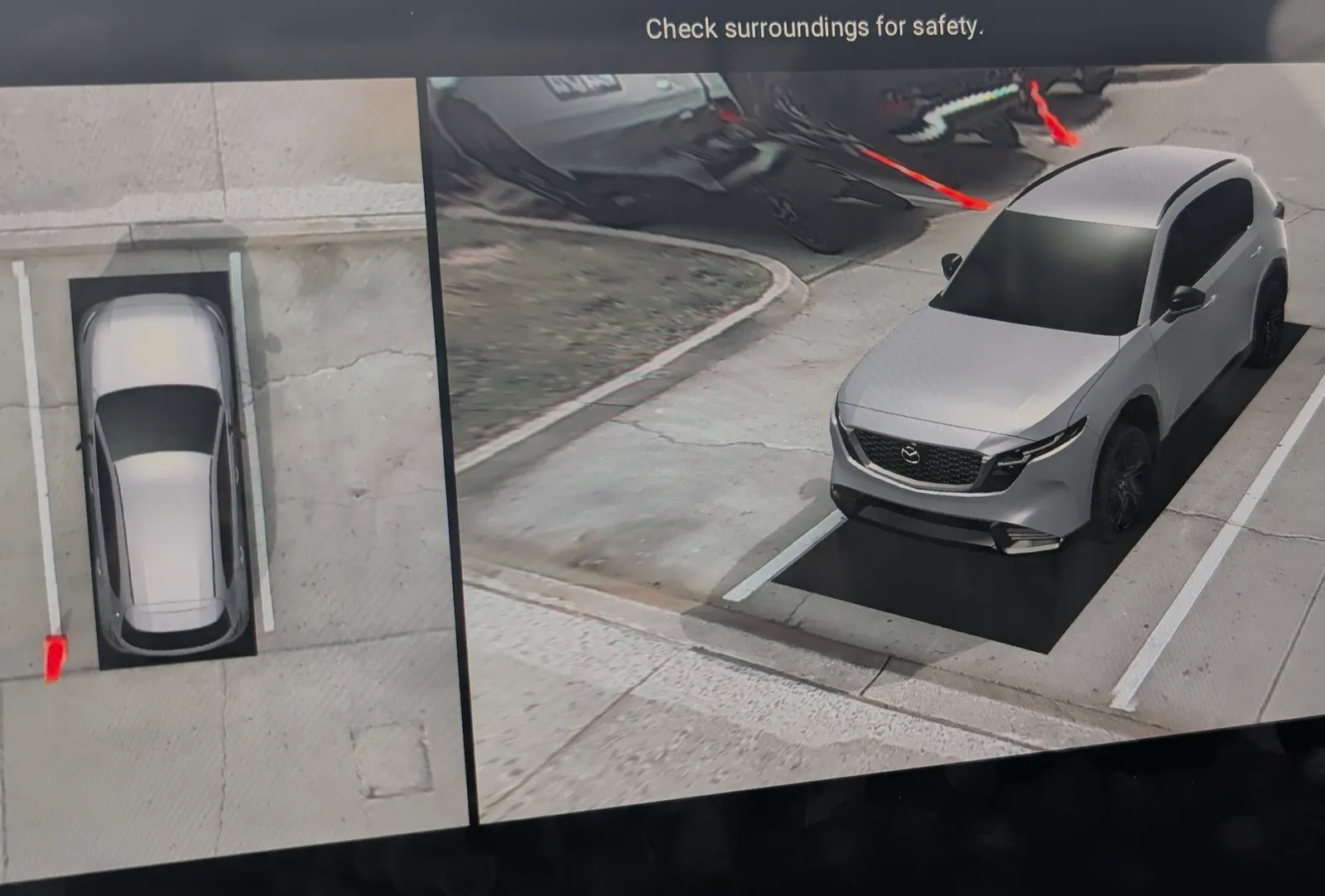 The infotainment screen in the 2026 Mazda CX5 showing its parking assist technology.