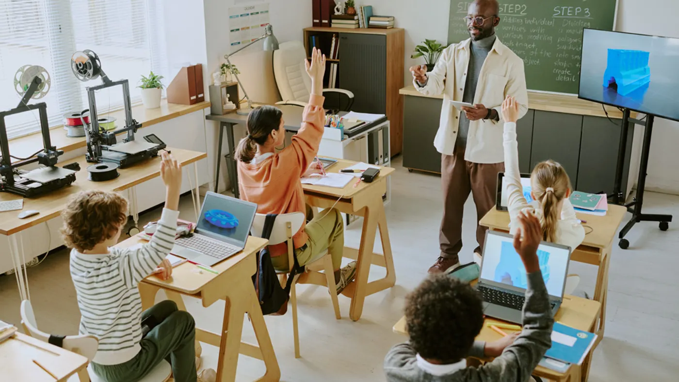 Teacher explaining lessons to students in classroom