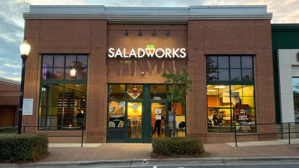 An image of a brick building with a logo that says Saladworks