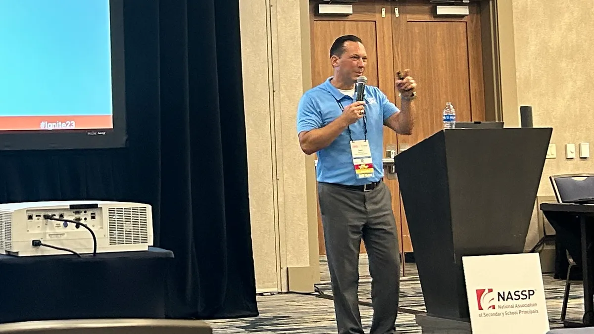 Adam Lane, a principal in Florida, presents his recruitment and retention strategies during a session at the NASSP Ignite '23 conference in Denver, Colo.