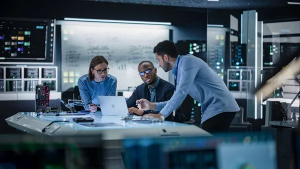 Colleagues working in a lab or data center