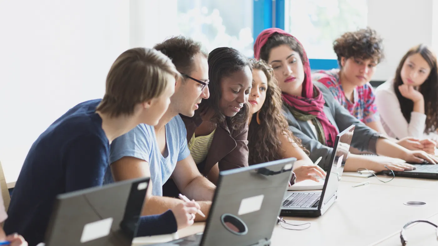 Group of students working on laptop computers