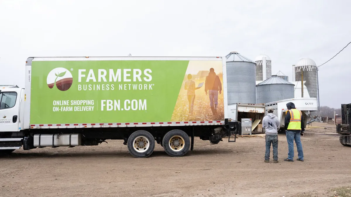 A Farmers Business Network truck makes a delivery.