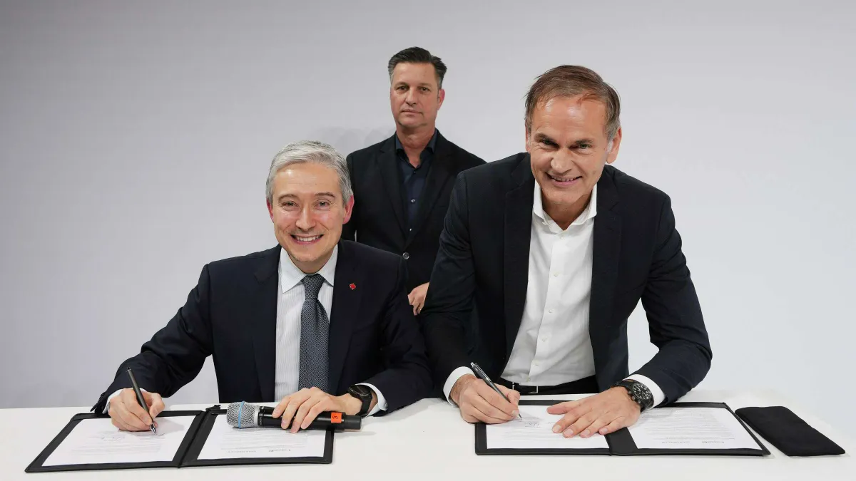 Leaders from Canada and Volkswagen sign an addendum to their August MOU.