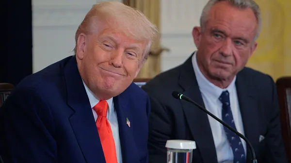 president trump smiling with robert kennedy jr.