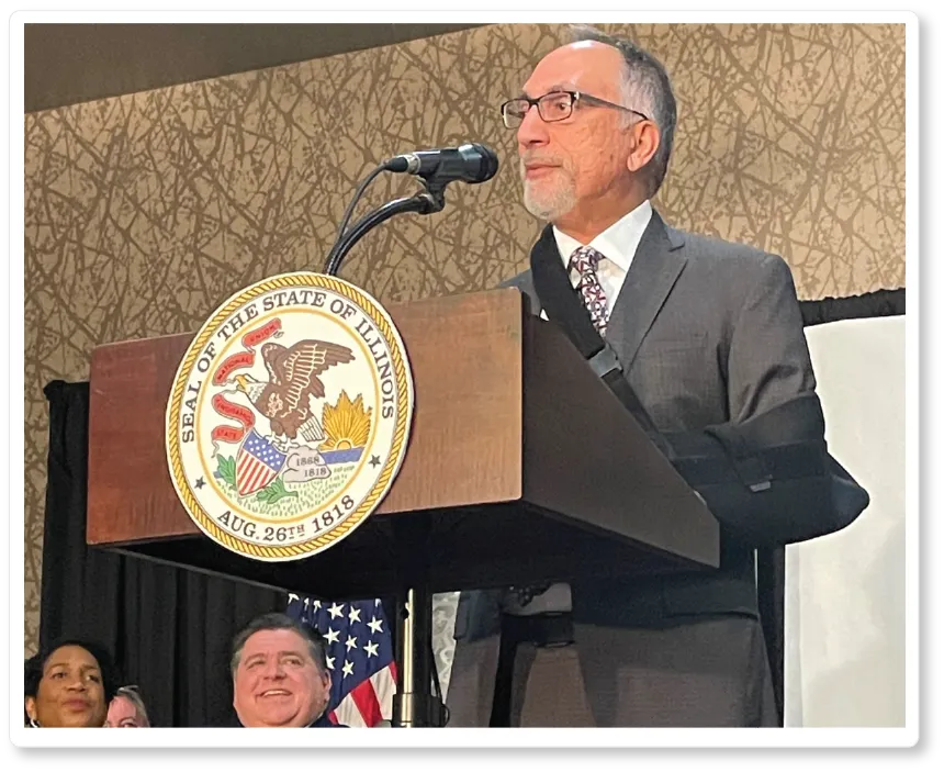 President and CEO Raj Bhargava stands at a podium announcing the new facility on June 1, 2023.