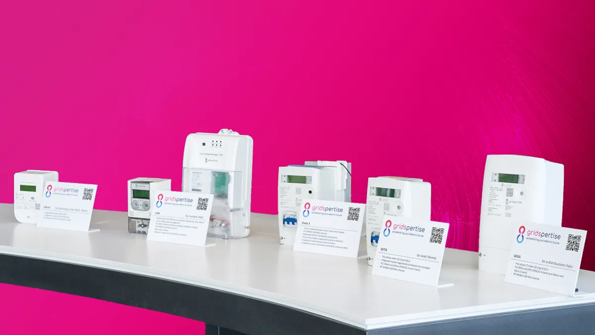 Branded Energy devices against a pink background